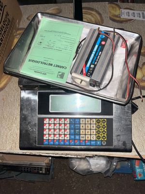 a calculator sitting on top of a box on the floor