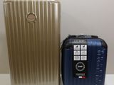 two pieces of luggage sitting next to each other on a table
