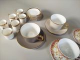 a lot of cups and saucers on the table