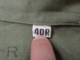 someone is holding a small piece of paper with the number 40 on it