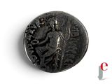 a close up of a coin with an image of a man on it