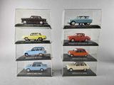 six different models of cars in a display case