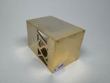 an image of a small metal box with a hole in it