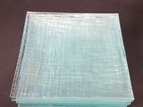 four pieces of clear glass are stacked on top of each other