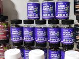 many bottles of good sleep products on a table