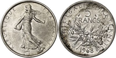 a close up of a coin with a woman on it