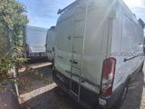 a white van that is parked next to another van