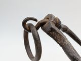 an old pair of scissors stuck in a cup