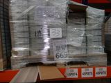 a large stack of boxes on a pallet in a warehouse