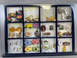 a shadow box with a bunch of pins in it