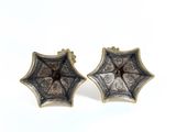 pair of antique silver and gold earrings with a flower design