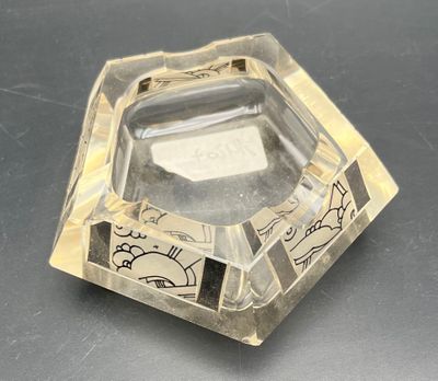 a clear glass ashtray with a picture of a cat on it