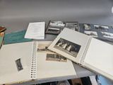 a lot of old photographs on the table