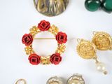 a lot of jewelry on a white surface
