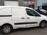 a white van parked in front of a building