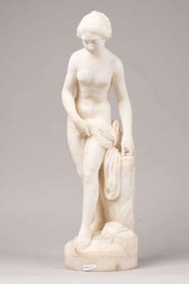 a white marble statue of a woman holding a bag
