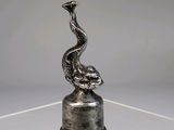 an image of a sculpture of a bird on top of a glass table