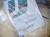 a box full of toilet paper and a book in it