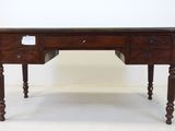 an old wooden desk with two drawers and a drawer underneath it
