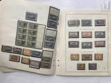 a lot of stamps on the pages of a book