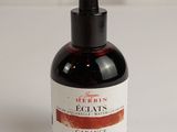 an image of a bottle of eclat ' s garbance sitting on a white surface