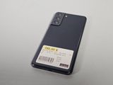 the back of a black cell phone with a price tag on it