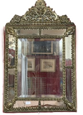a mirror hanging on the wall with pictures on the wall