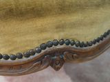 an image of a close up of a chair with a gold velvet upholstered seat