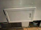 an image of a refrigerator door with a venter on it
