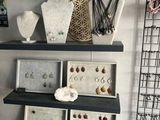 a shelf that has some jewelry on it