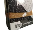 a box of black and white quilts on a white background