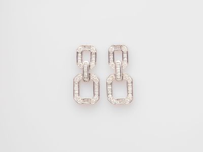 a pair of white gold and diamond earrings
