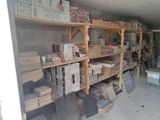 many boxes and boxes on the shelves in the garage