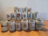 a lot of beer mugs sitting on a table