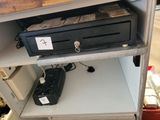 an image of a cash register on a shelf in a store