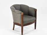 an upholstered chair with a wooden frame and upholstered seat