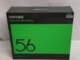 the box is open on a white surface with a green background