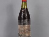 a bottle of wine that is sitting on a table