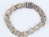 silver plated chain bracelet with a square clasp on a white background