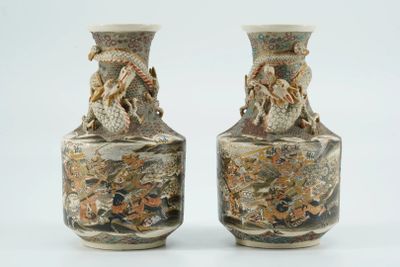 two vases sitting side by side on a white surface