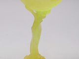a yellow glass vase with a tree on it