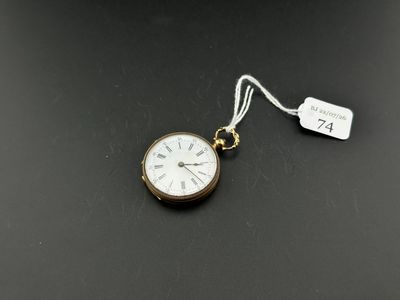a close up of a pocket watch on a table with a price tag