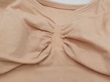 an image of a woman ' s bra top with a large bow on the front