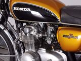 a yellow and black motorcycle parked in a garage