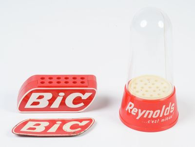 a small red pepper shaker next to a small red pepper shaker