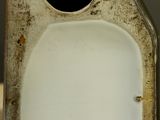 a close up of a white toilet with a black lid