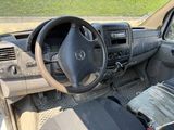 a picture of a dirty car with a steering wheel and dashboard