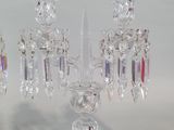 three crystal candelabs that are on a table
