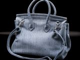 denim bag on a black background with copy space for your text