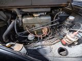 an old car engine with a lot of wires in it